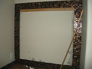 Glass Tiles Installed Around Future Mirror in Office Shower. July 25, 2009